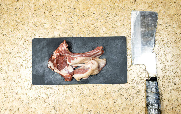 Raw Lamb Chops on a Dark board  - Photo, image