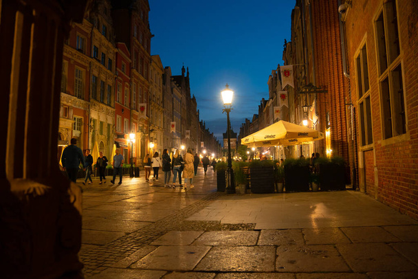 Scenic summer evening panorama of the architectural evening street of the Old Town GDANSK, POLAND - July 6, 2022 - Fotó, kép