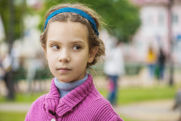 little girl in purple sweater - Фото, изображение