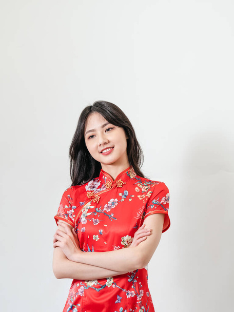 Portrait of beautiful young asian woman wearing traditional cheongsam qipao dress isolated on white background. - 写真・画像