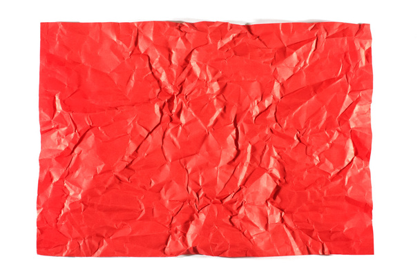 Red wrinkled sheet of paper isolated - 写真・画像