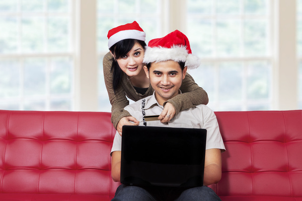 Couple smiling on camera while buy online - Photo, Image