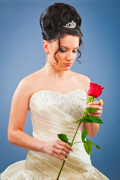 Beautiful bride with rose in studio shooting - Фото, зображення