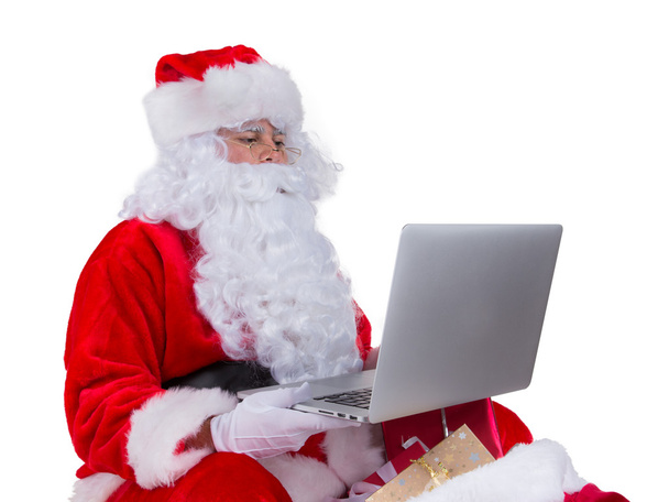 Santa Claus with laptop - Foto, afbeelding