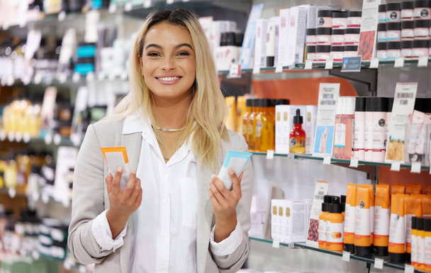 Cropped portrait of an attractive young woman shopping in a cosmetics store. - Photo, Image