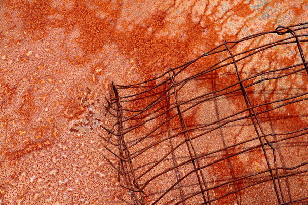 Horzontal format of red rusty wire on rusted metal plate - Fotoğraf, Görsel