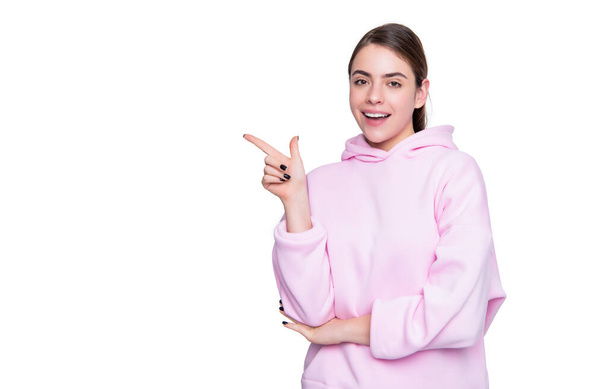 smiling young girl in pink hoodie isolated on white background. - Fotografie, Obrázek