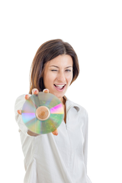 smiling woman holding up compact disc or cd  and looking at came - Photo, Image