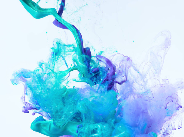 Mixed ink dynamic abstract background with splash of acrylic paint in water. Flowing acrylic backdrop picture - Foto, Bild