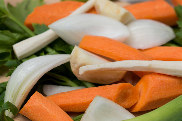peeled raw fresh vegetables for broth closeup selective focus - Фото, зображення