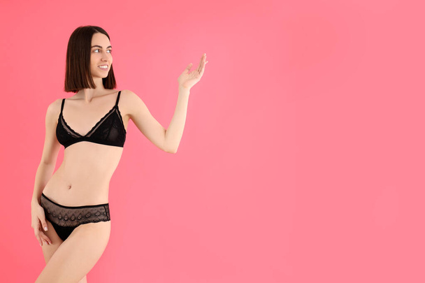 Concept of beauty with slim young woman on pink background - Foto, immagini