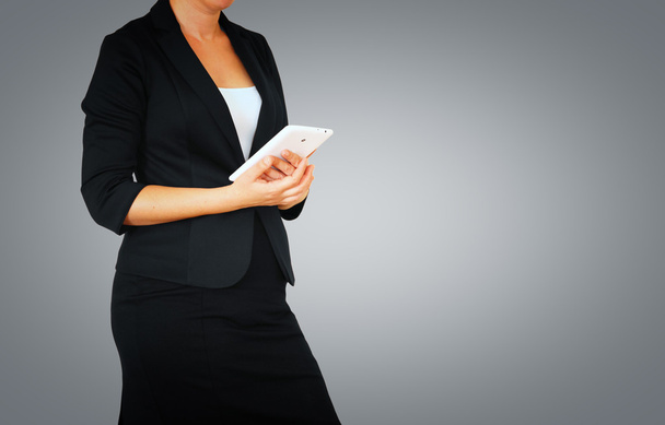 Woman in business suit on gray elegant background - Foto, Imagem