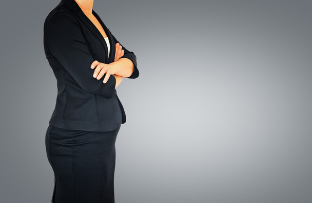 Woman in business suit on gray elegant background - 写真・画像