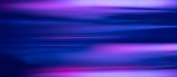 Blur neon glow. Fluorescent banner. Futuristic illumination. Defocused UV navy blue purple pink color light flare motion on modern abstract background. - Фото, изображение