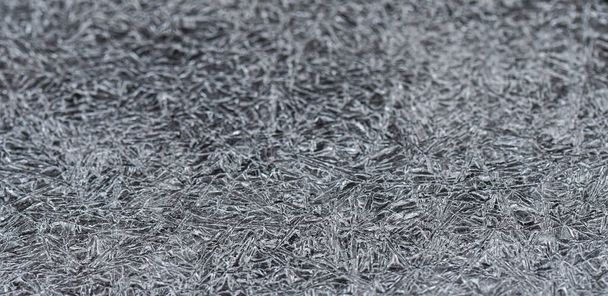 Closeup or macro of ice crystals of frozen water in winter season - Photo, image