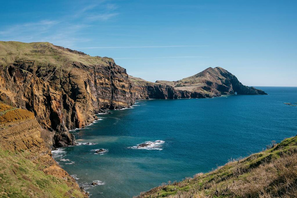 A calm sea and rocks on a bright day in Madeira, Portugal - Foto, imagen