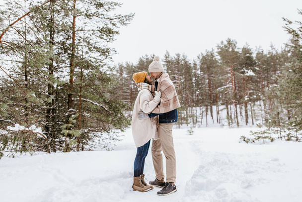 people, love and leisure concept - happy smiling couple touching noses in winter park - Fotó, kép
