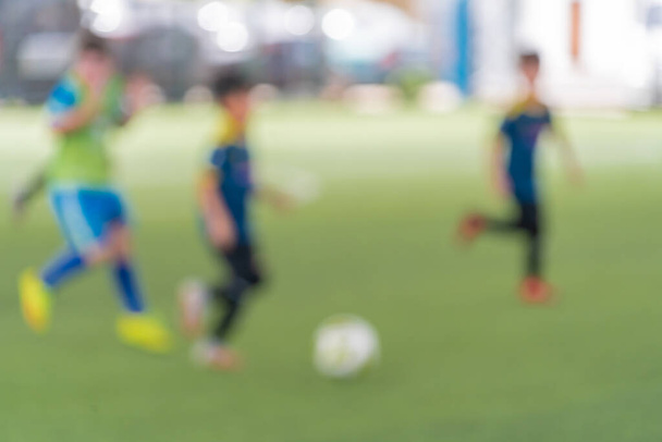 Blurred kid soccer match in indoor artificial field. - Φωτογραφία, εικόνα
