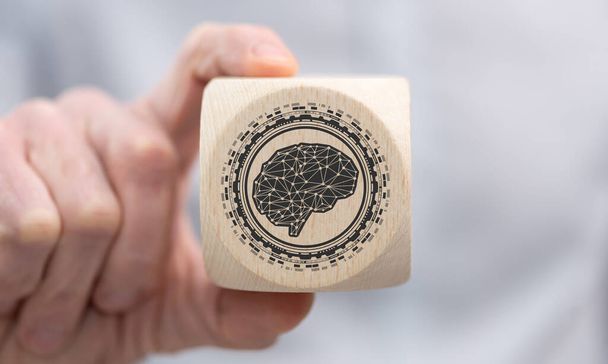 Main tenant un cube en bois avec symbole du concept d'apprentissage profond - Photo, image