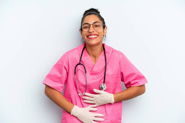hispanic  woman laughing out loud at some hilarious joke. nurse concept - Valokuva, kuva