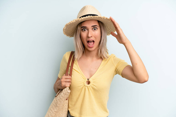 blonde woman looking happy, astonished and surprised. summer concept - Foto, Imagem