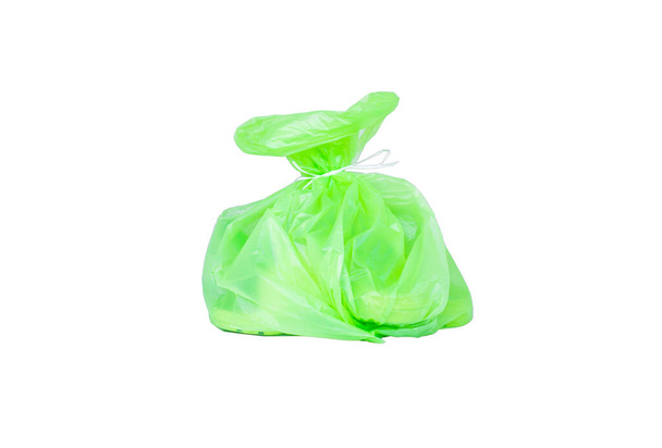 Garbage bags green split the white backdrop. - Foto, immagini