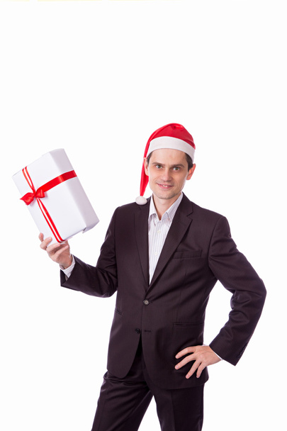 man suit and hat with Christmas gift in hand on white backgro - 写真・画像