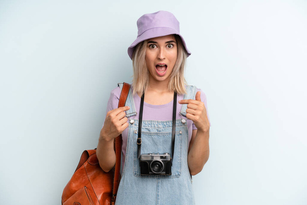 blonde woman feeling happy and pointing to self with an excited. summer tourist concept - Fotoğraf, Görsel