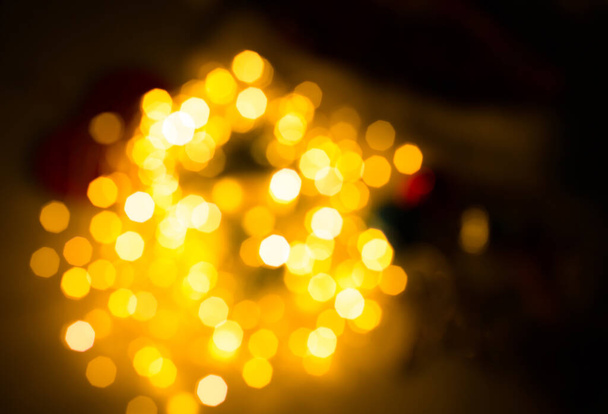 Blurred lights photo with. Abstract festive holidays background, bokeh effect. Christmas lights and garland decorations. - Fotoğraf, Görsel