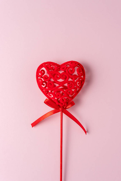 Red heart decor on pink background. Minimal love concept. - Photo, image