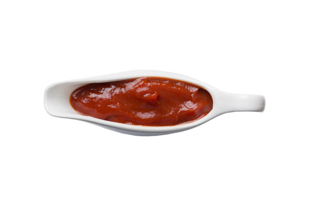 Creamy ketchup sauce in the white sauceboat. ketchup sauce isolated on white background. top view. - Foto, afbeelding