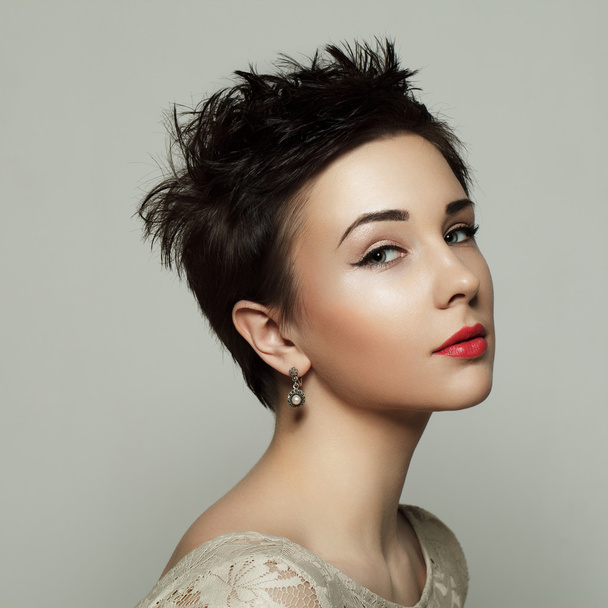 Portrait of a beautiful young girl with short hair. Black and wh - Zdjęcie, obraz