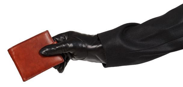 Zloděj v černém obleku drží hnědá kožená kabelka - Fotografie, Obrázek