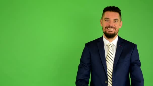 Business man smiles - green screen - studio - Footage, Video