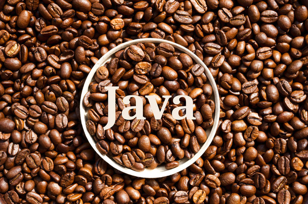 Java. Roasted coffee beans in a paper cup lid against the background of beans. Grains of a tropical plant. Environmentally friendly glass. - Foto, Imagem