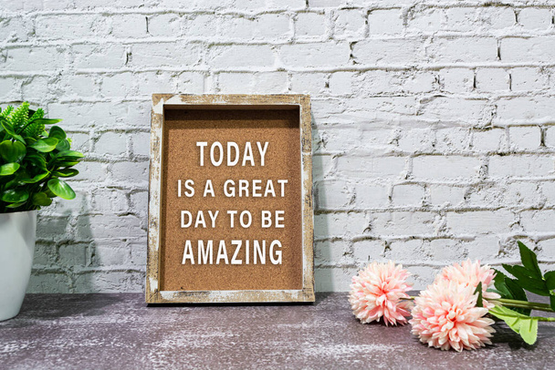 Inspirational and motivational quote with phrase today is a great day to be amazing on wooden frame. - Photo, Image