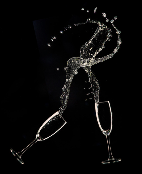 Champagne flutes on black background - Foto, afbeelding