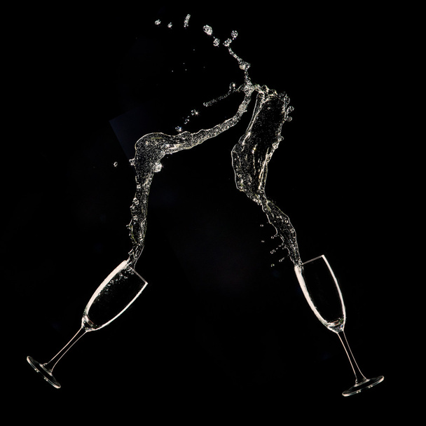 Champagne flutes on black background - Fotó, kép