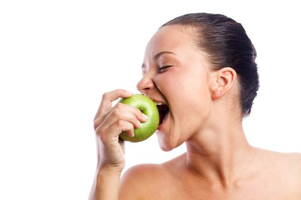Woman with green apple - Foto, afbeelding