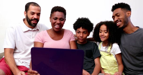 African interracial family speaking on video conference with relatives on laptop webcam - Photo, Image