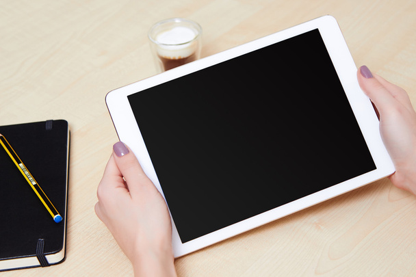 Woman holds mobile tablet - Photo, Image