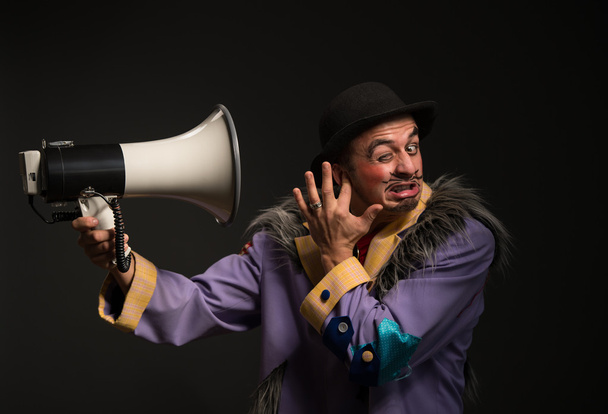 Clown shouting at the megaphone - Photo, image