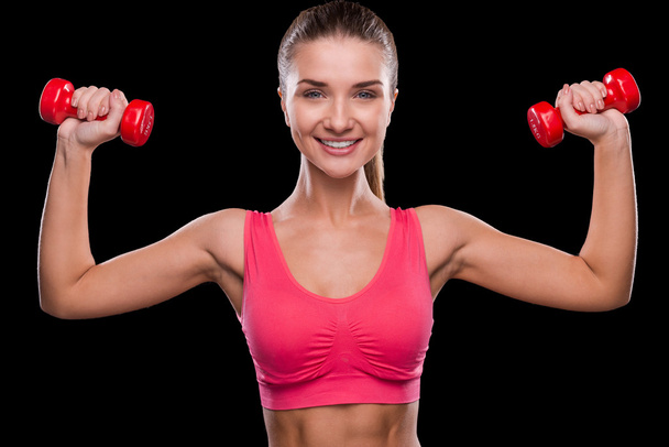 Woman exercising with dumbbell - Foto, immagini