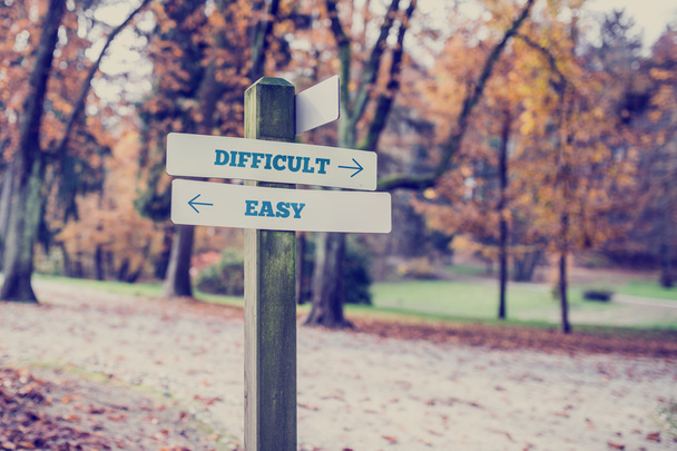 Opposite directions towards difficult and easy - Photo, Image