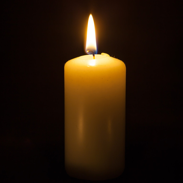 Candle on the black background - Photo, Image