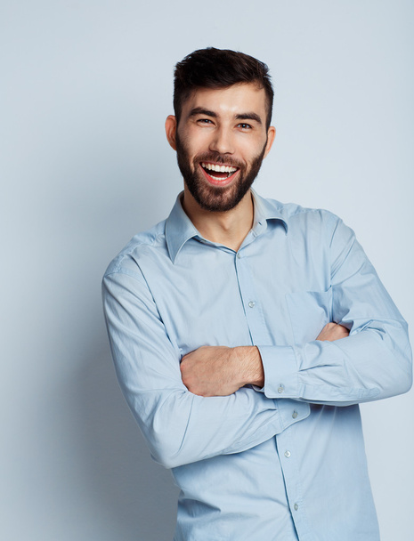 A young bearded man smiling - Φωτογραφία, εικόνα