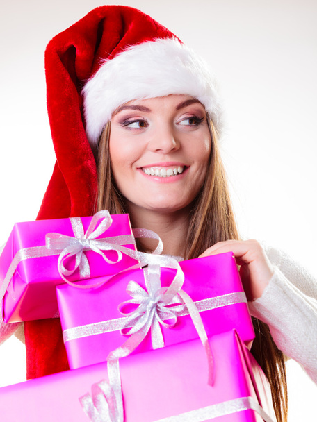 Woman in  santa helper hat holding pink gift boxes - Фото, изображение