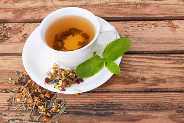 Cup of green tea on wooden background - Valokuva, kuva