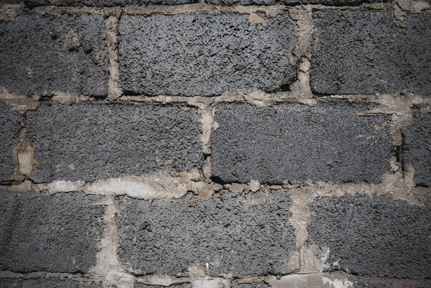 Photo of Gray hollow brick wall. Perfect for background. Vintage version. - Photo, Image