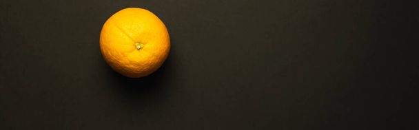Top view of orange isolated on black, banner  - Foto, imagen